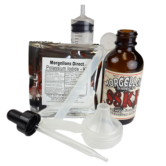 picture of kit contents: bottle, water syringe, scoop, funnel label and on packet of potassium iodide crystals.